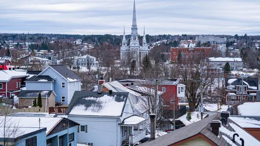 Saint-Georges church in Saint-Georges city in Beauceville Quebec in a winter cloudy day