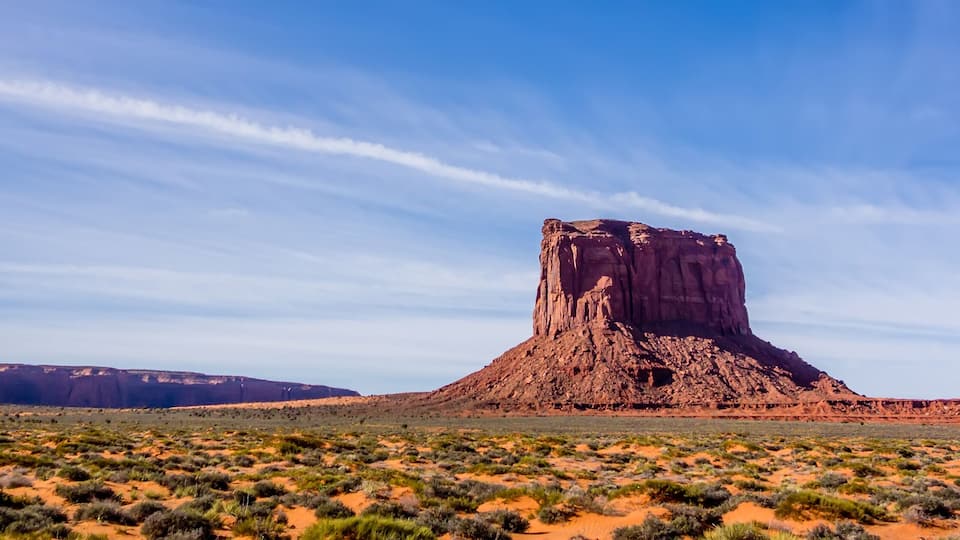 A desert landscape with prominent rock formations.