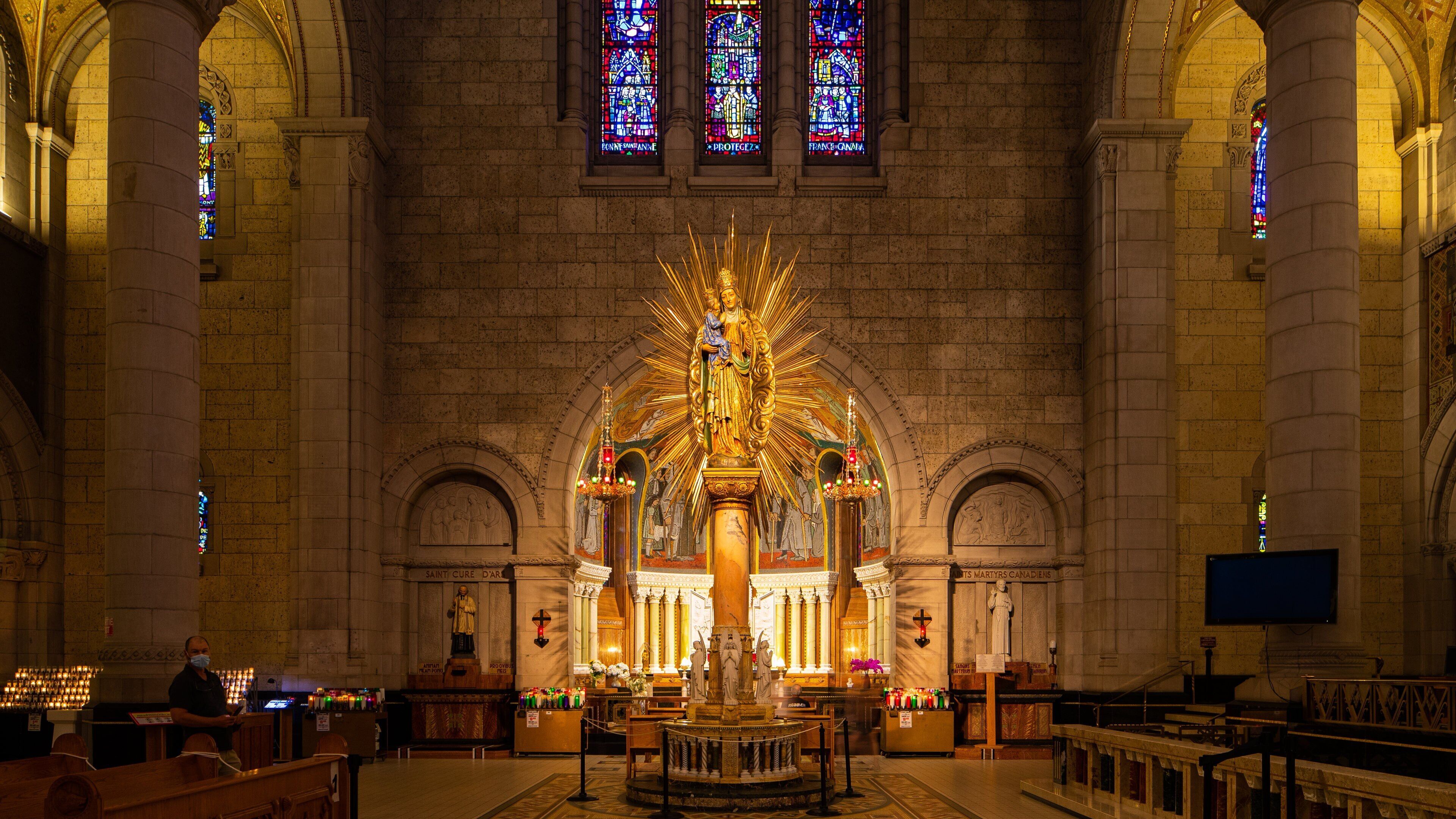 Basilica of Sainte-Anne-de-Beaupré featuring a church or cathedral, interior views and heritage elements
