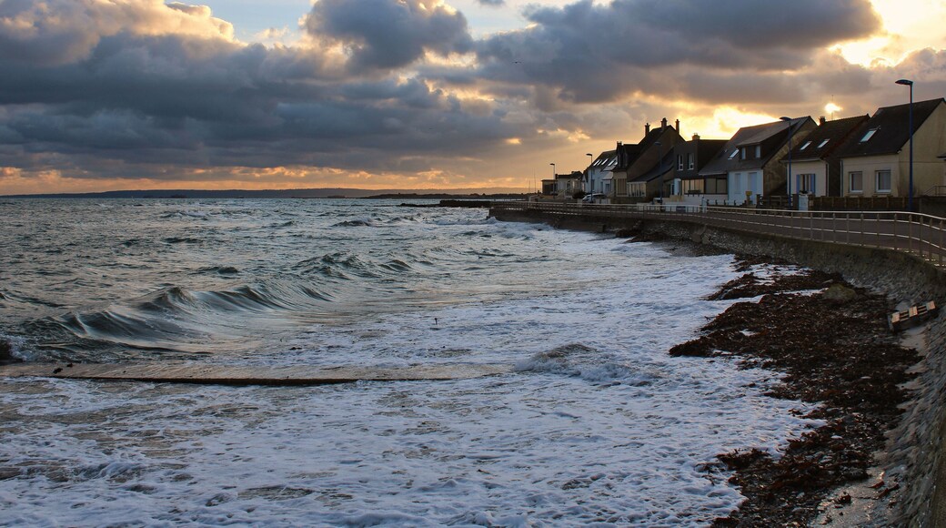 Scenic view of waves on the coastal village of Urville-Nacqueville in France during sunset