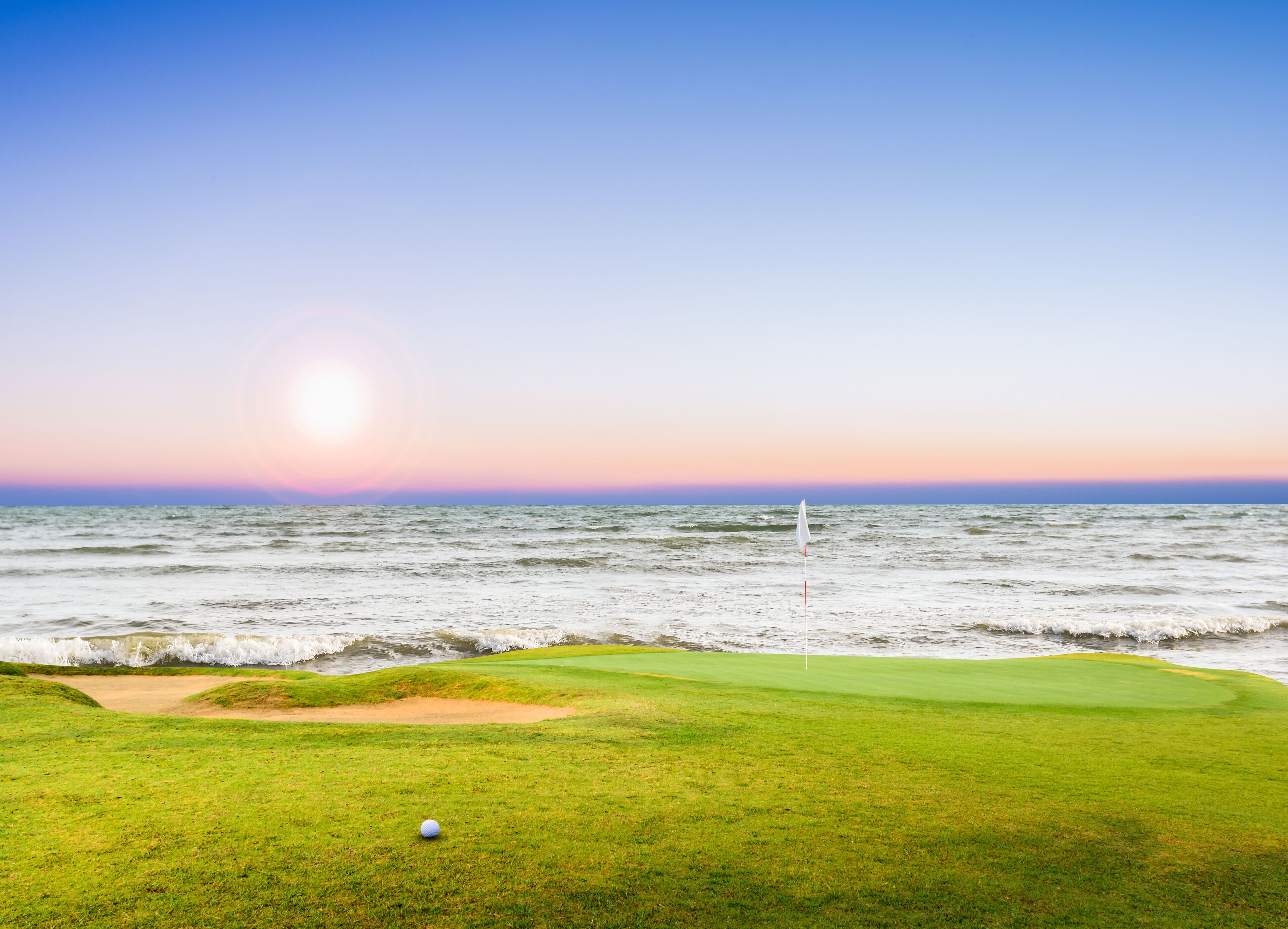 golf course and golf ball on green