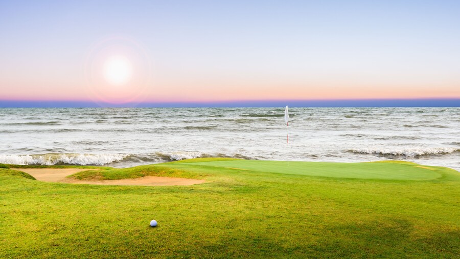 golf course and golf ball on green