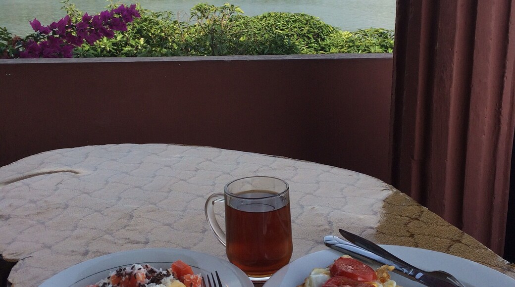 Amazing breakfast views and the tastiest fried egg and tomato on toast. I don't know what they do but it's perfect. American breakfast only 40,000IDR includes fruit salad and a hot drink. The restaurant has 270 degree views of beautiful Lake Toba.
