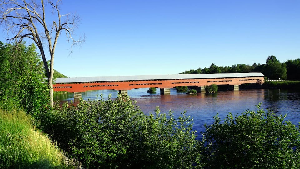 Red covered bridge across the Coulonge River in western Quebec