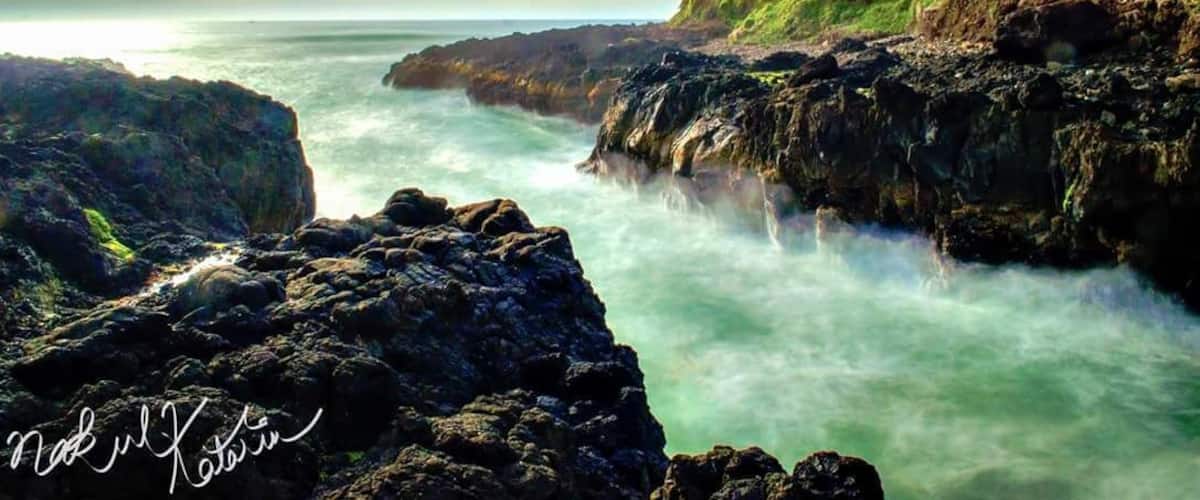 Cape Perpetua is a place full of surprises, one being Devils Churn. 
The other places to look out for in the area are Cook's Chasm, and Thor's Well. It looks best during the high tide.