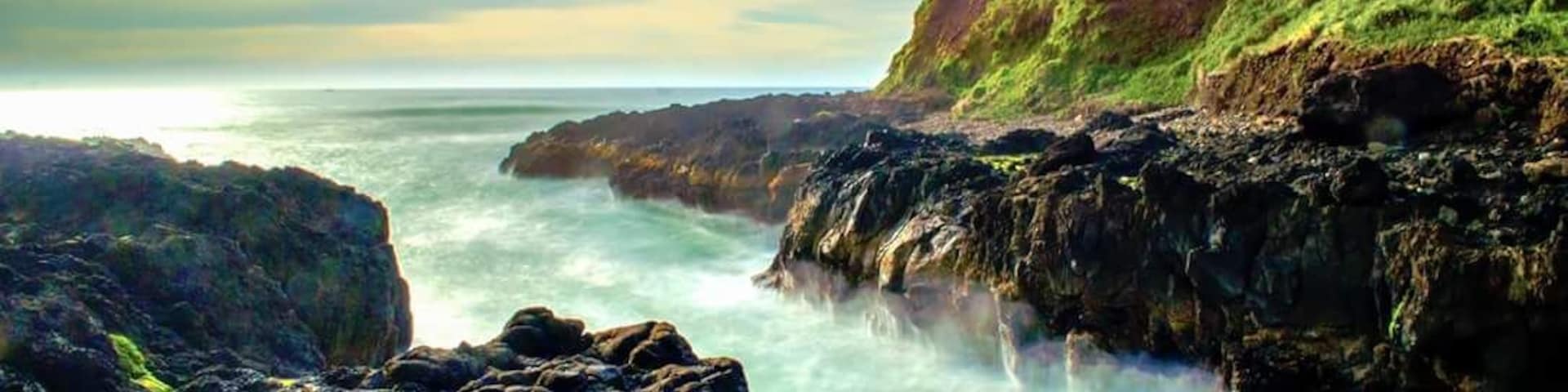 Cape Perpetua is a place full of surprises, one being Devils Churn. 
The other places to look out for in the area are Cook's Chasm, and Thor's Well. It looks best during the high tide.