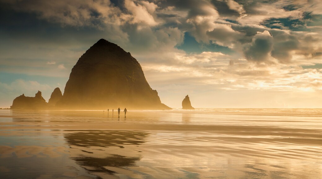 Evening stroll on Oregon's Cannon Beach with the iconic Haystack Rock looming large