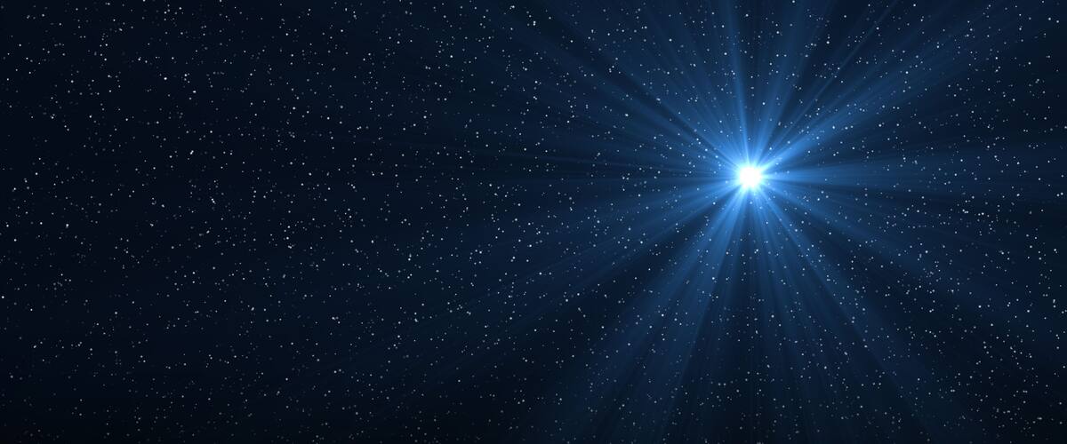A starry night sky with a bright star.