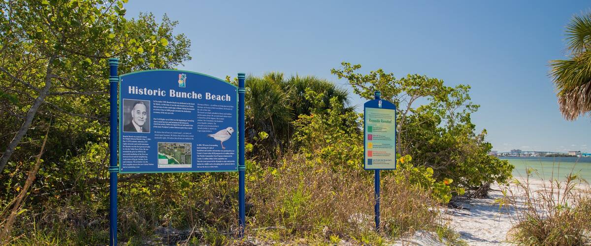 Bunche Beach showing signage and a beach