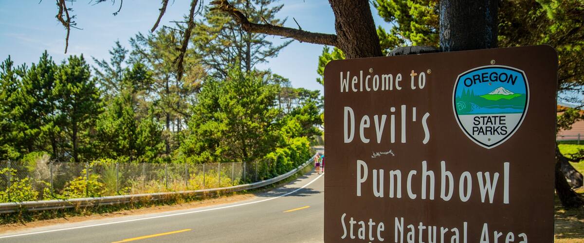 A welcome sign for Devil's Punchbowl State Natural Area in Oregon.