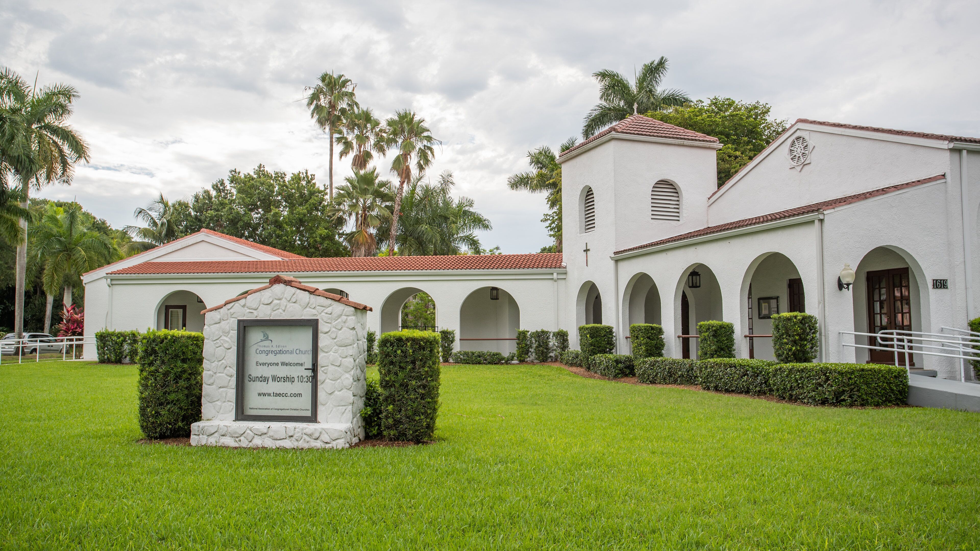 Thomas Edison Congregational Church featuring a church or cathedral and signage