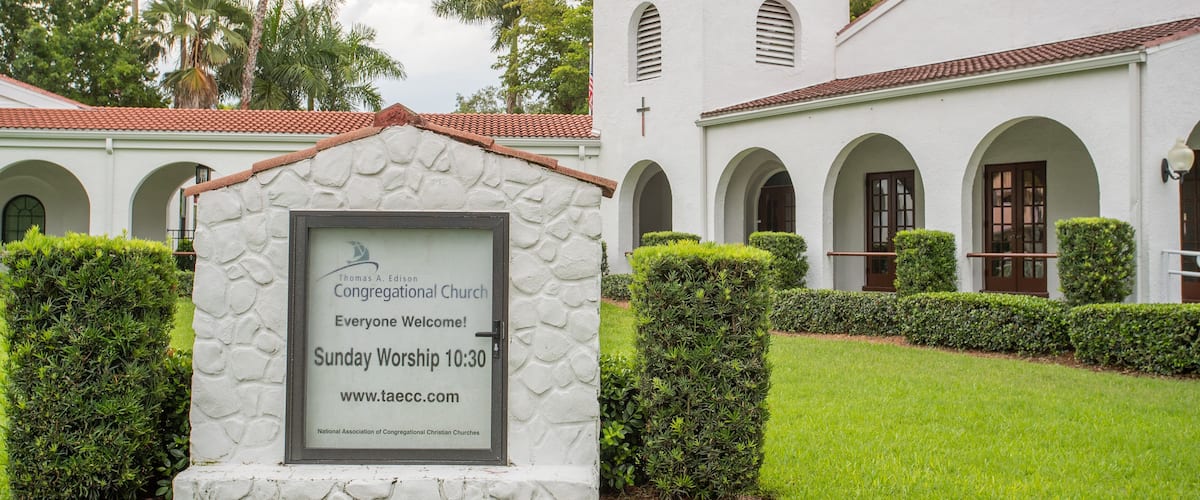 Thomas Edison Congregational Church featuring signage and a church or cathedral