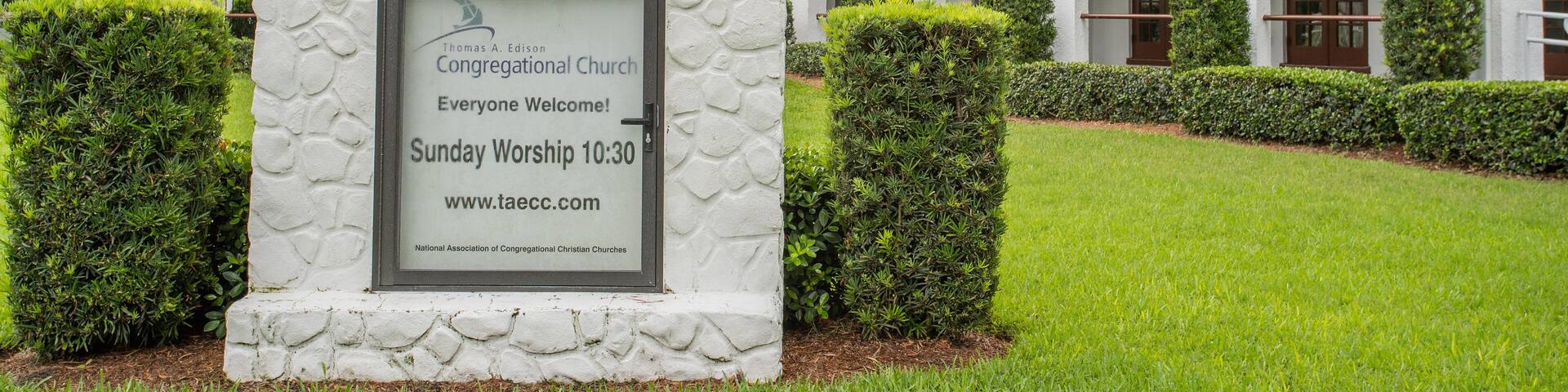Thomas Edison Congregational Church featuring signage and a church or cathedral