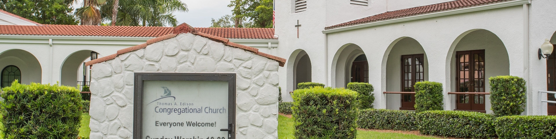 Thomas Edison Congregational Church featuring signage and a church or cathedral