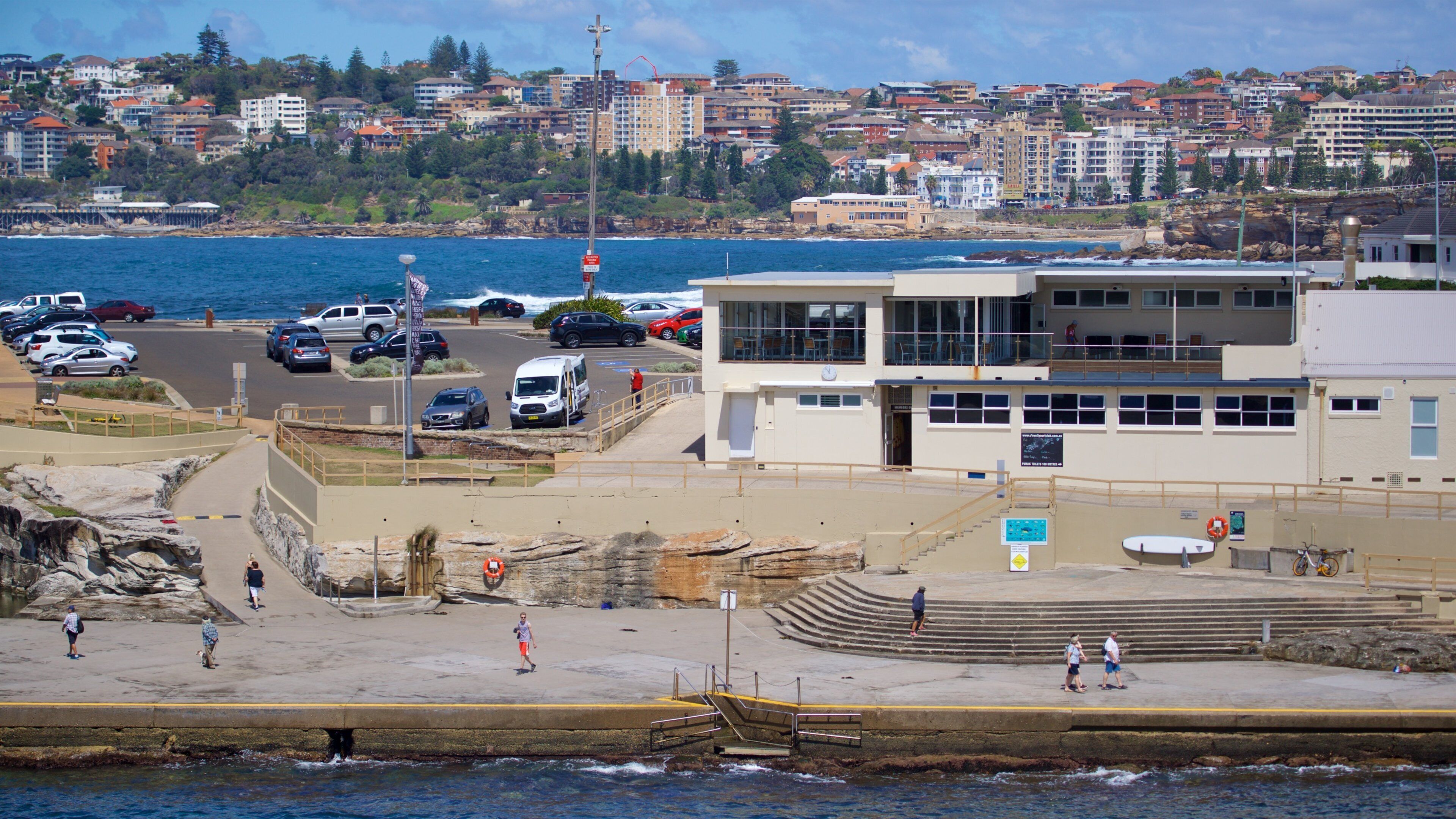 Clovelly Beach which includes general coastal views and a coastal town