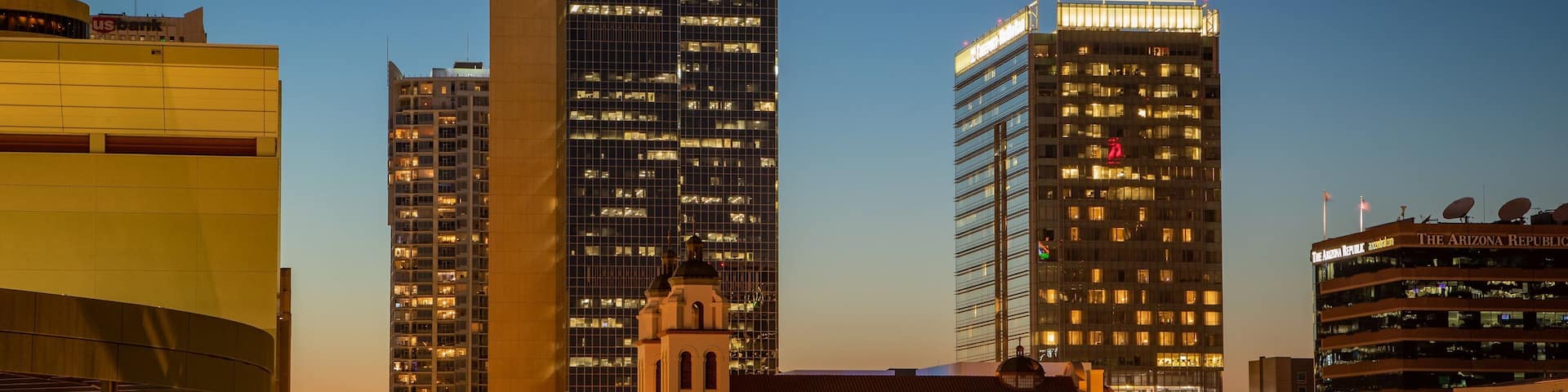 A cityscape with prominent buildings including a Chase bank and The Arizona Republic building.