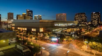 Midtown which includes a city and night scenes