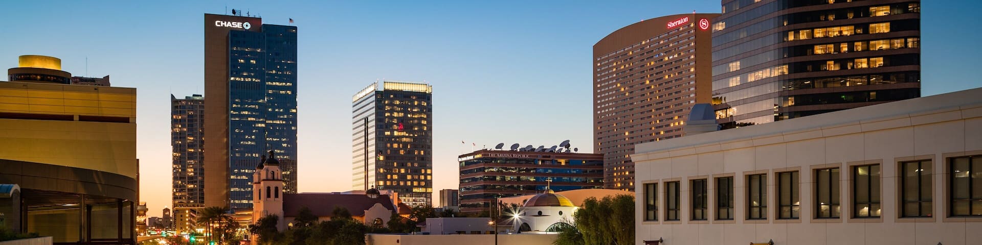Downtown Phoenix showing a city and night scenes