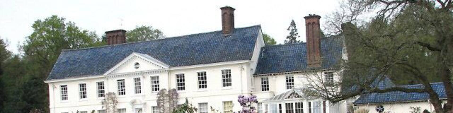 Stody Lodge and Gardens Stody Lodge, viewed across flower bed. Stody Lodge, as it stands today, was rebuilt by Lord Rothermere in the beginning of the 1930s; the original house had been damaged by a fire. The new house was not erected at the site of the old one; instead, a woodland was cleared to make room for the new Lodge and Gardens. The garden covers an area of 10 acres; its main feature is the collection of rhododendrons and azaleas, which is described as being one of the largest and most dramatic in East Anglia. Japanese Water Gardens were also created; these are located in the southwestern corner of Lodge Plantation, on the other side of the Holt Road. The water gardens are believed to have been planted with more than 2000 Azalea mollis. The gardens are open to the public on only six days per year, usually in May when the rhododendron are at their best.