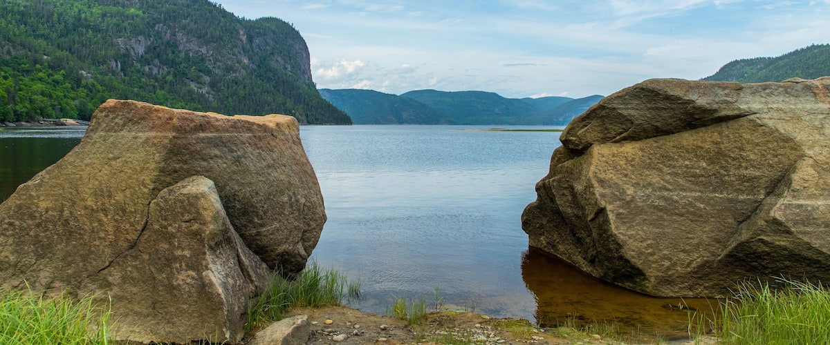 Parc National du Fjord-du-Saguenay featuring a lake or waterhole