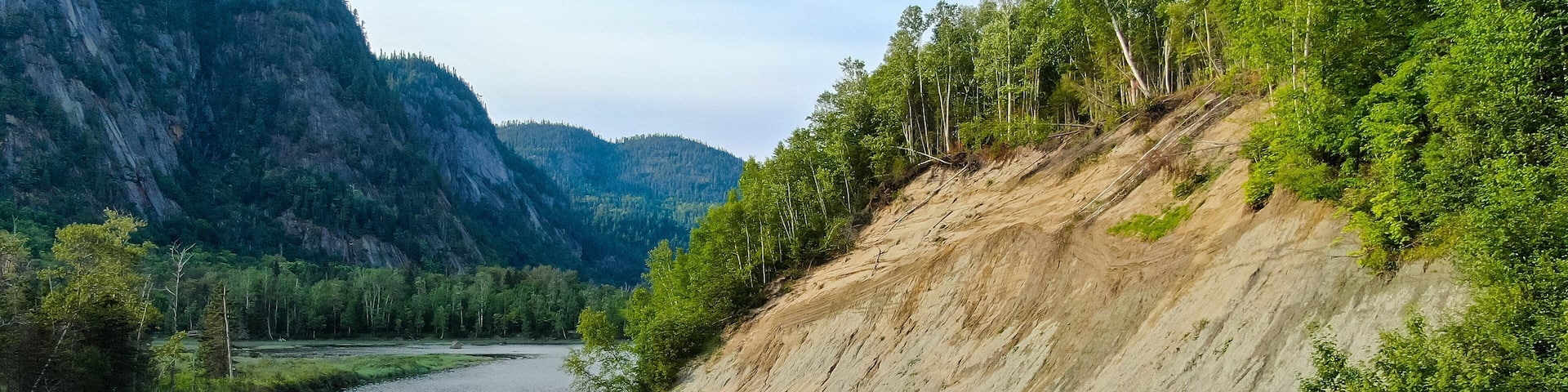 Parc National du Fjord-du-Saguenay which includes tranquil scenes and a river or creek