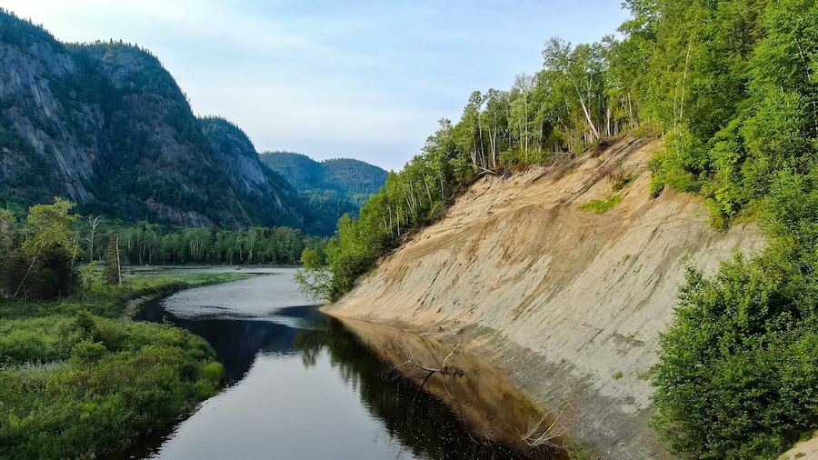 Parc National du Fjord-du-Saguenay which includes tranquil scenes and a river or creek