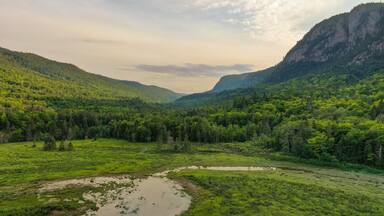 Parc National du Fjord-du-Saguenay showing tranquil scenes, a sunset and mountains