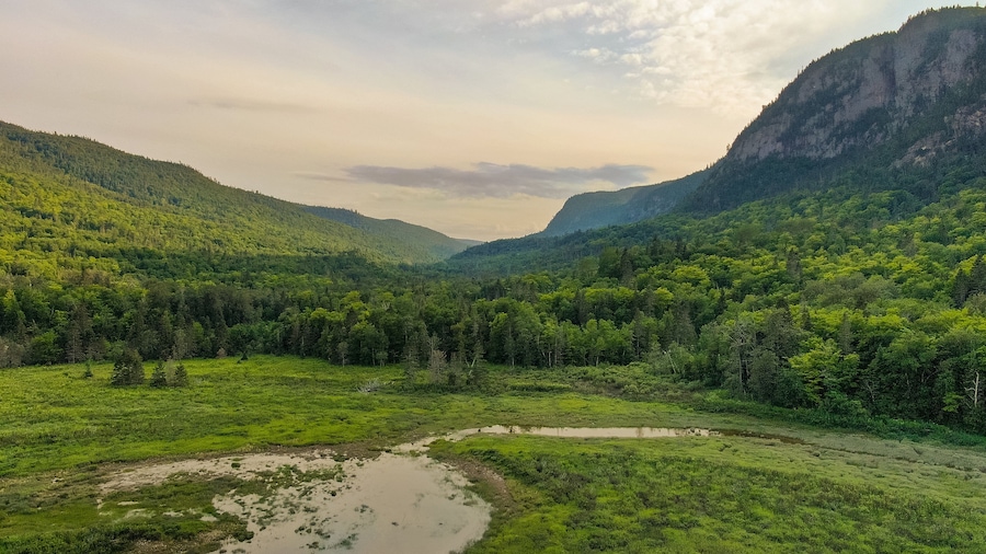 Parc National du Fjord-du-Saguenay showing tranquil scenes, a sunset and mountains