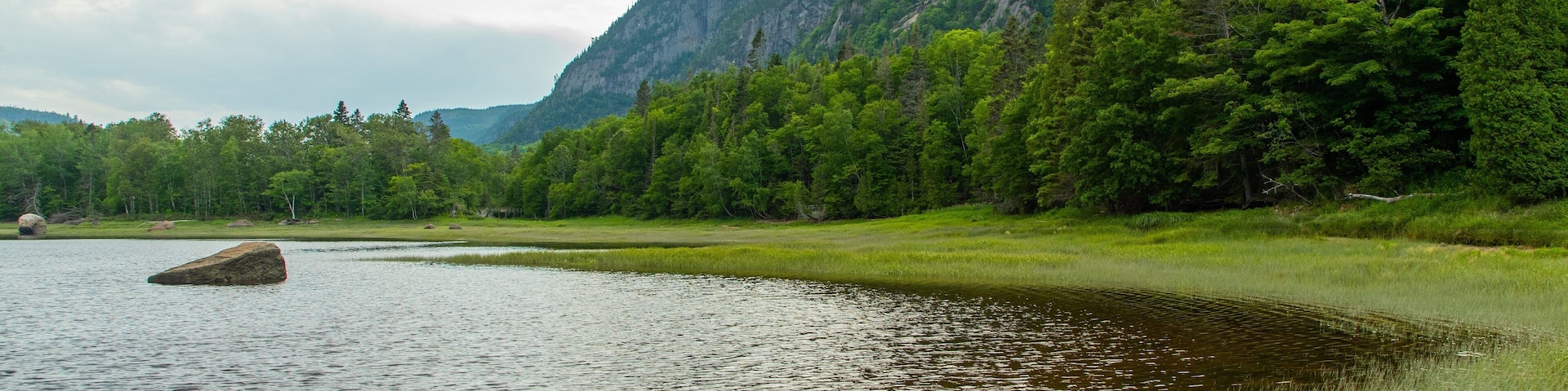 Parc National du Fjord-du-Saguenay showing mountains, tranquil scenes and a lake or waterhole