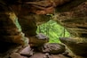 In Hocking Hills State Park, Ohio, Rock House is a twenty-five foot tall cave, on the side of a tall sandstone cliff, with seven natural Gothic-arched windows lighting its two hundred foot length.