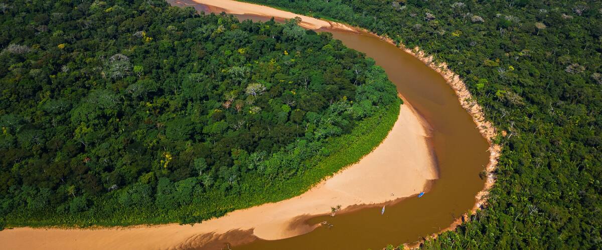 Navigating the Heath River, a natural border between Peru and Bolivia, a biodiverse place filled with pristine forests