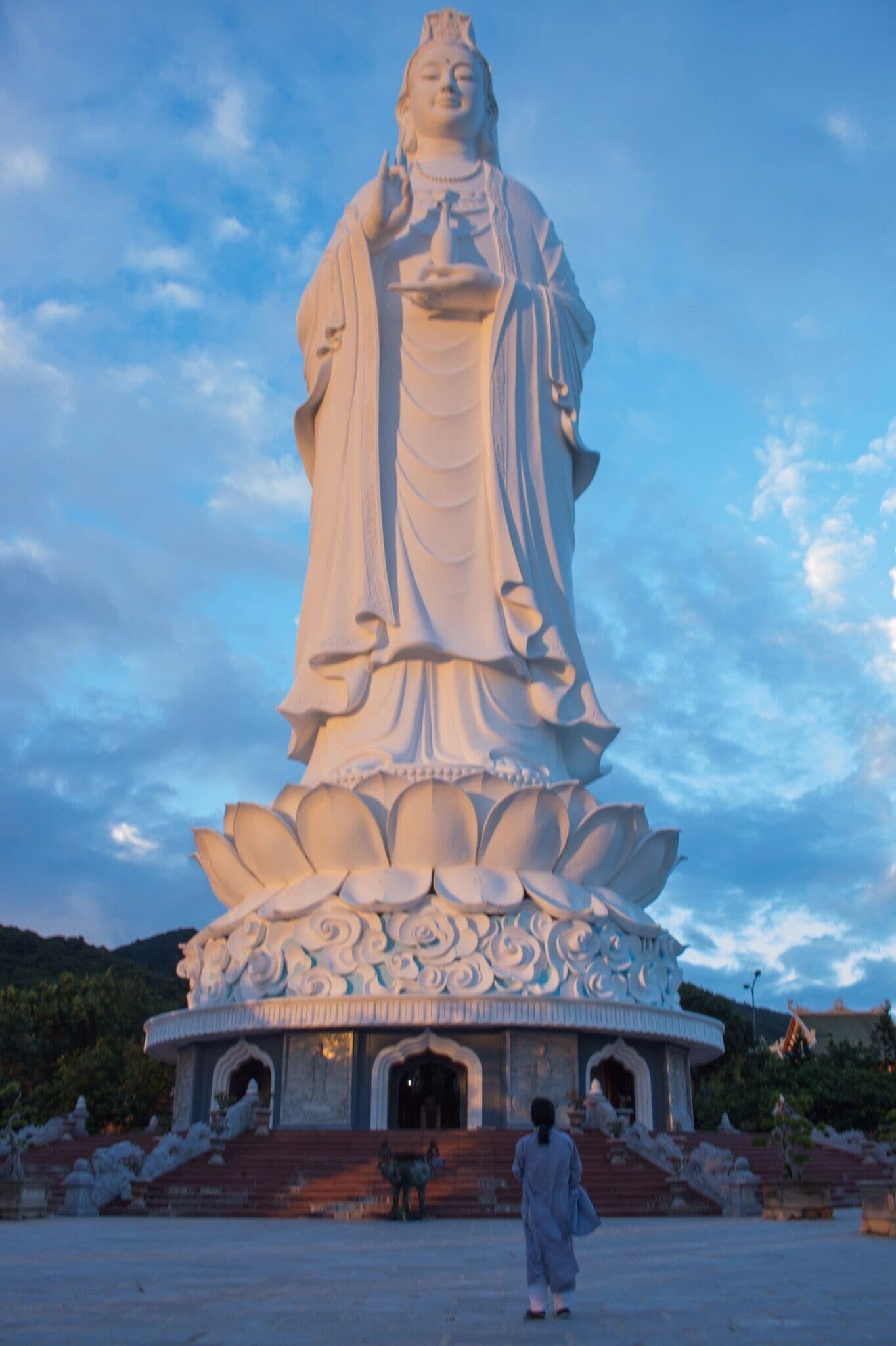 Lady praying to Lady Buddha in Da Nang Vietnam.