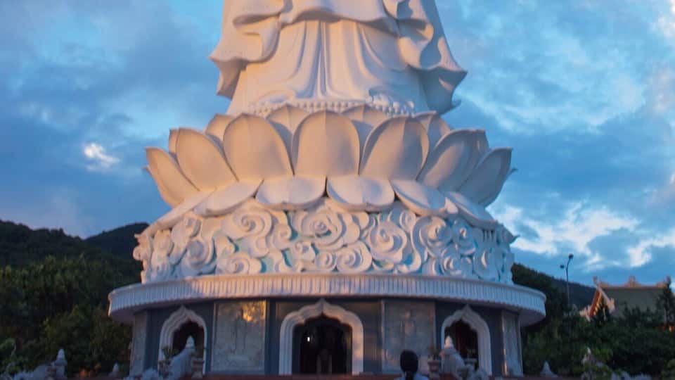 Lady praying to Lady Buddha in Da Nang Vietnam.