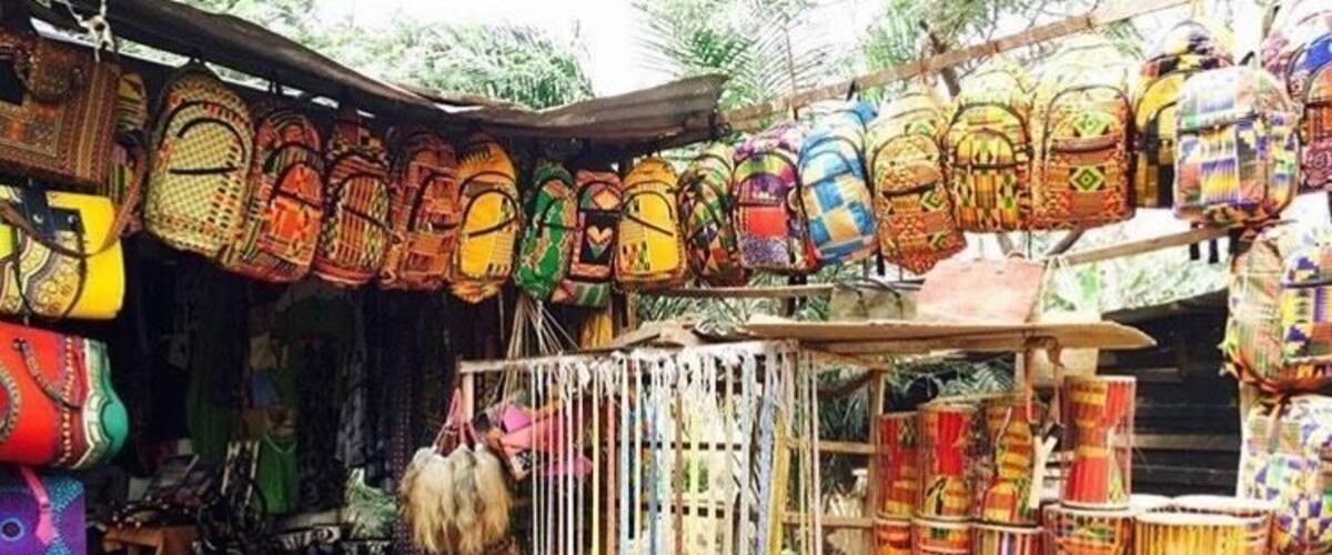 You can find lots of colorful souvenirs at small roadside markets like this one. There’s an even bigger market called the Art Centre in downtown Accra. Pro tip: learn to haggle (or travel with a friend who can!) #culture #africa #accra #ghana