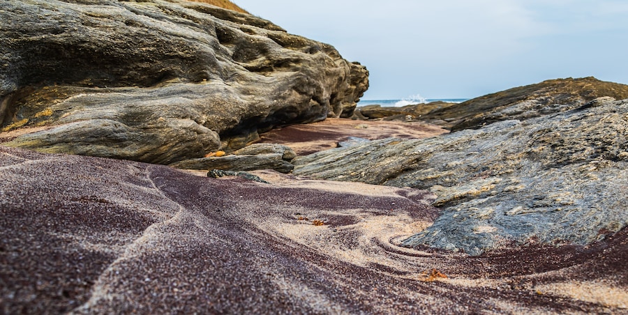 Africa beach mixed with black sand and lighter sand from the natural vegetation of the time, photo taken in Accra Ghana West Africa