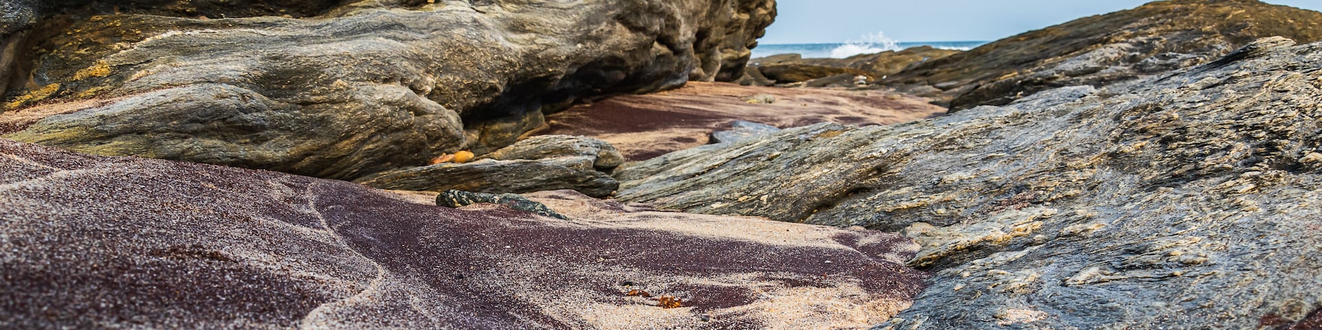 Africa beach mixed with black sand and lighter sand from the natural vegetation of the time, photo taken in Accra Ghana West Africa