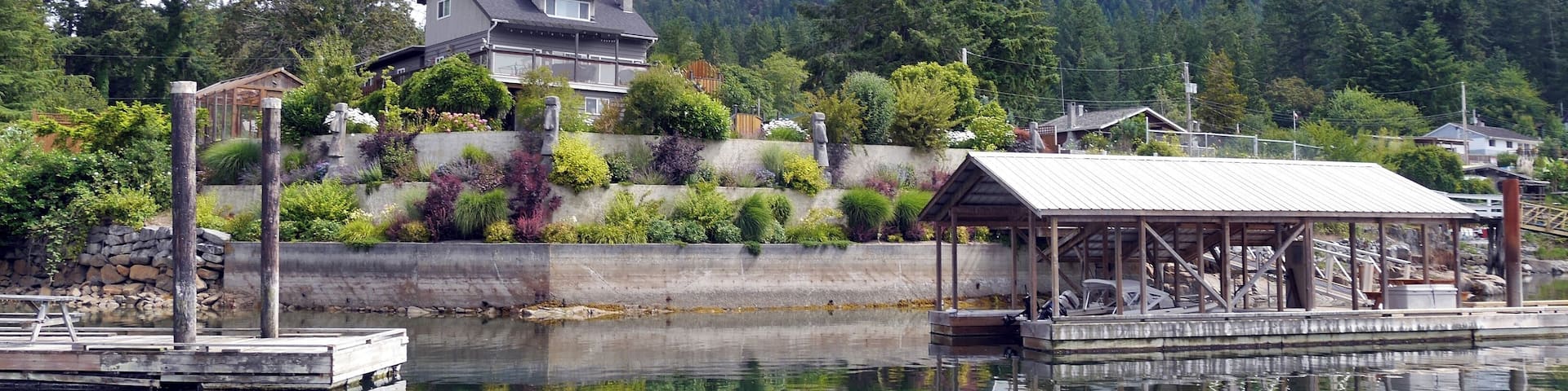 Garden Bay is a small village tucked away between the waters of Garden Bay and Hospital Bay on the Sunshine Coast of British Columbia.
The population of the area is around 300 though there are some wonderful seaside properties such as this one with lovely private marinas.
