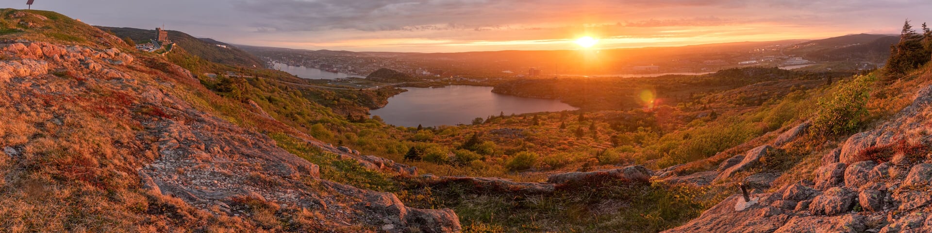 Panorama of St Johns Newfoundland from the top of Signal Hill National Historic Site at sunset.