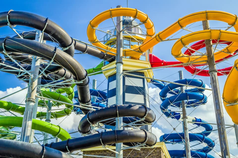 A water park with multiple water slides in various colors.
