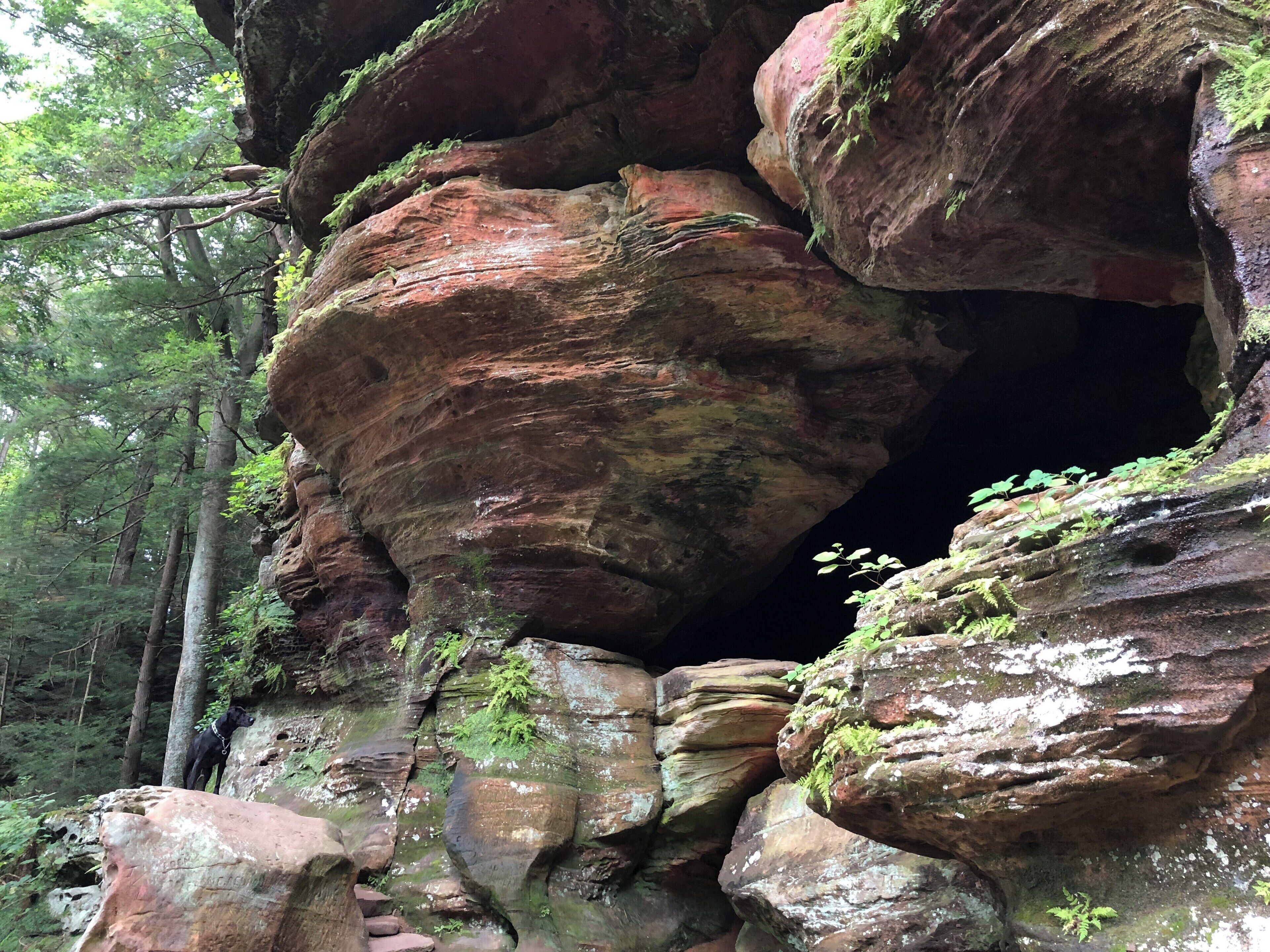 See that dog in the bottom left? That’s Chubs. He loves going off leash and taking me and my friends on a new #Adventure. We ended up at Rock House in Hocking Hills State Park. This spot is amazing; you can climb up into a cave on the side of the hill, and the way it’s naturally carved truly stepped into a house that overlooks the forest. Visitors can’t carve writings into the walls there now, but there are names and carvings from visitors that go back hundreds of years.