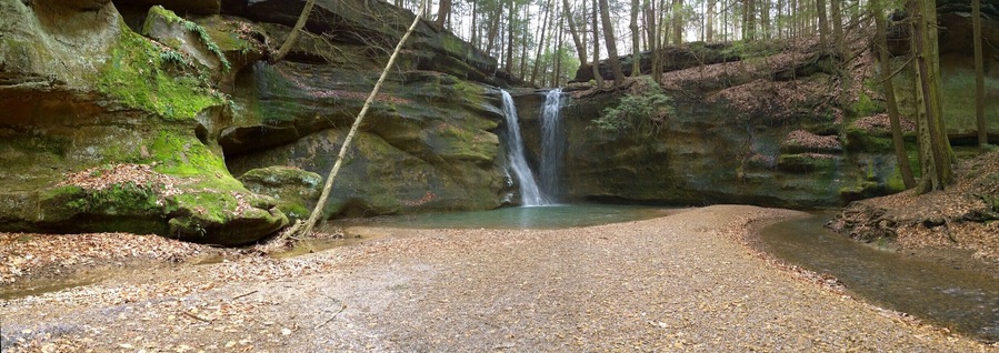 The highlight of the hike has to be the waterfalls at the end of the box canyon.
Rock Stalls Natural Sanctuary is a 70 acre private preserve in the Hocking Hills area that is owned and operated by Camp Akita, but the management of Camp Akita also allows access to the general public.
The sanctuary is definitely off the beaten path in the sometimes tourist heavy hocking hills area. It offers a quiet bit of respite with beautiful scenery in a box canyon with a creek and waterfalls.