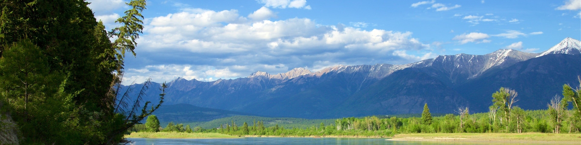 Skookumchuck which includes a lake or waterhole, mountains and tranquil scenes