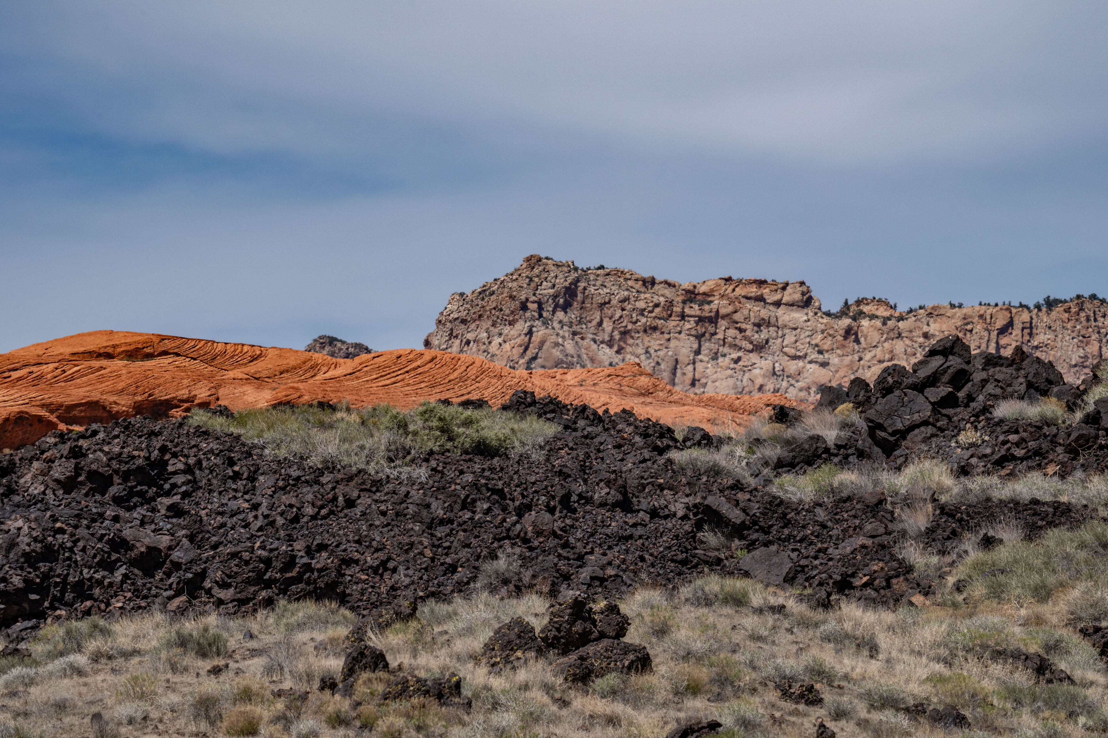  Santa Clara lava flow / basalt (Qbs) with Navajo Sandstone (Lower Jurassic), Snow Canyon State Park, Utah geology. Red Cliffs National Conservation Area