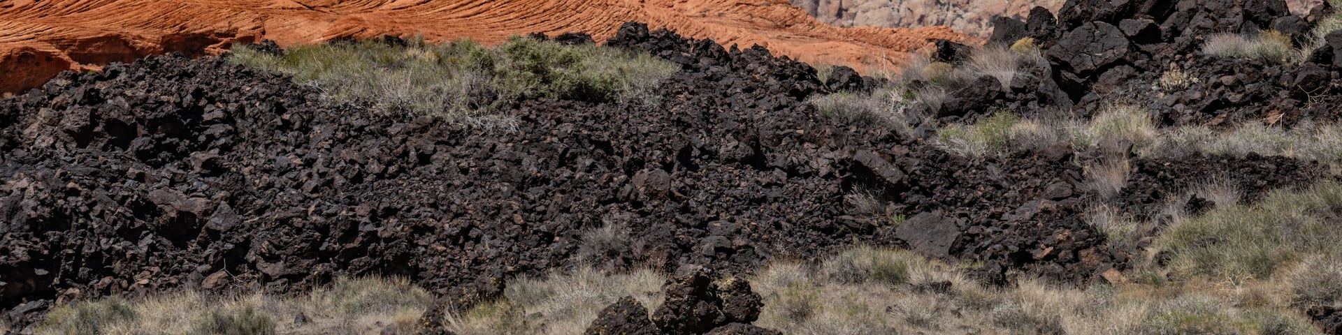 Santa Clara lava flow / basalt (Qbs) with Navajo Sandstone (Lower Jurassic), Snow Canyon State Park, Utah geology. Red Cliffs National Conservation Area