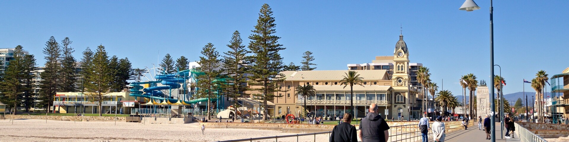Glenelg Jetty which includes a beach and general coastal views as well as a couple