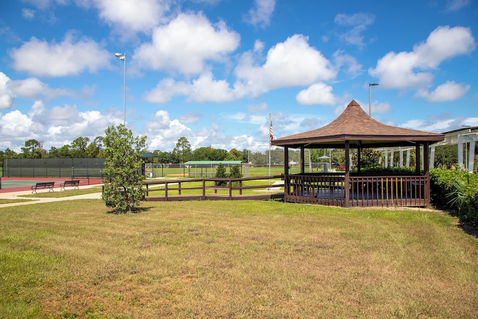 A gazebo, a baseball field, and a tennis court.