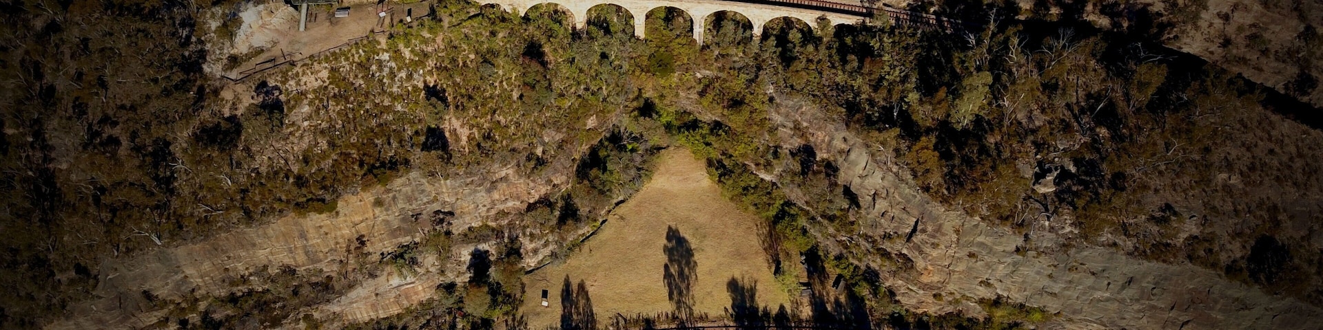 We spent yesterday arvo bush-bashing down to the Zig Zag Railway viaducts above Lithgow, NSW and looking around the place for a few hours.
In this shot you can see the No. 1 Viaduct on the Top Road track. A little further down is the larger No. 2 Viaduct. And on the Bottom Road (which is the train line near the bottom of this pic) is the No. 3 Viaduct. 
Comprising rock cuttings, classical sandstone viaducts and tunnels, the Lithgow Zig Zag was, and remains to this day, a magnificent piece of engineering. Construction of this part of the rail system began in 1866 and was completed by the late 1890s. The line was decommissioned in 1910 with the construction of the Ten Tunnels deviation which is still in use today by state rail. 
Back in the early 1970s, volunteers worked to bring the line back into operation as an iconic tourist railway which ran for decades, bringing with it tourism dollars to the wider Lithgow area. 
In 2013, a huge bushfire swept through the area and destroyed a lot of the infrastructure and equipment used by the Zig Zag Railway. Since that day work has proceeded to slowly bring the tourist train line back into operation It is hoped it'll be up and running again in the next year or so.
Follow @zigzagrailway on Insta and Facebook for updates.
For more pics of this awesome area, check out the 4WD Swagman facebook page.
#zigzagrailway
#lithgow
#stoneviaduct
#railway
#bluemountains
#djimavicpro