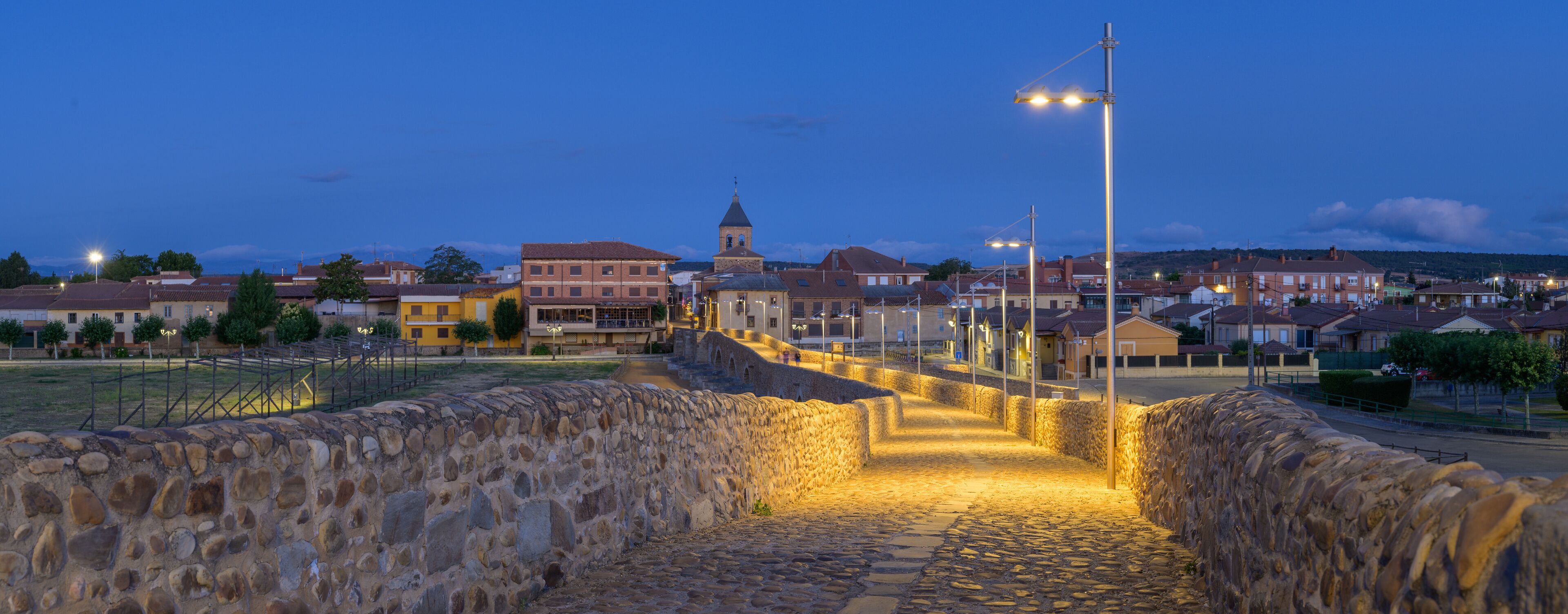 Summer's Awakening: Unveiling the Roman Bridge along the Camino de Santiago in Hospital de Orbigo, Leon, Spain