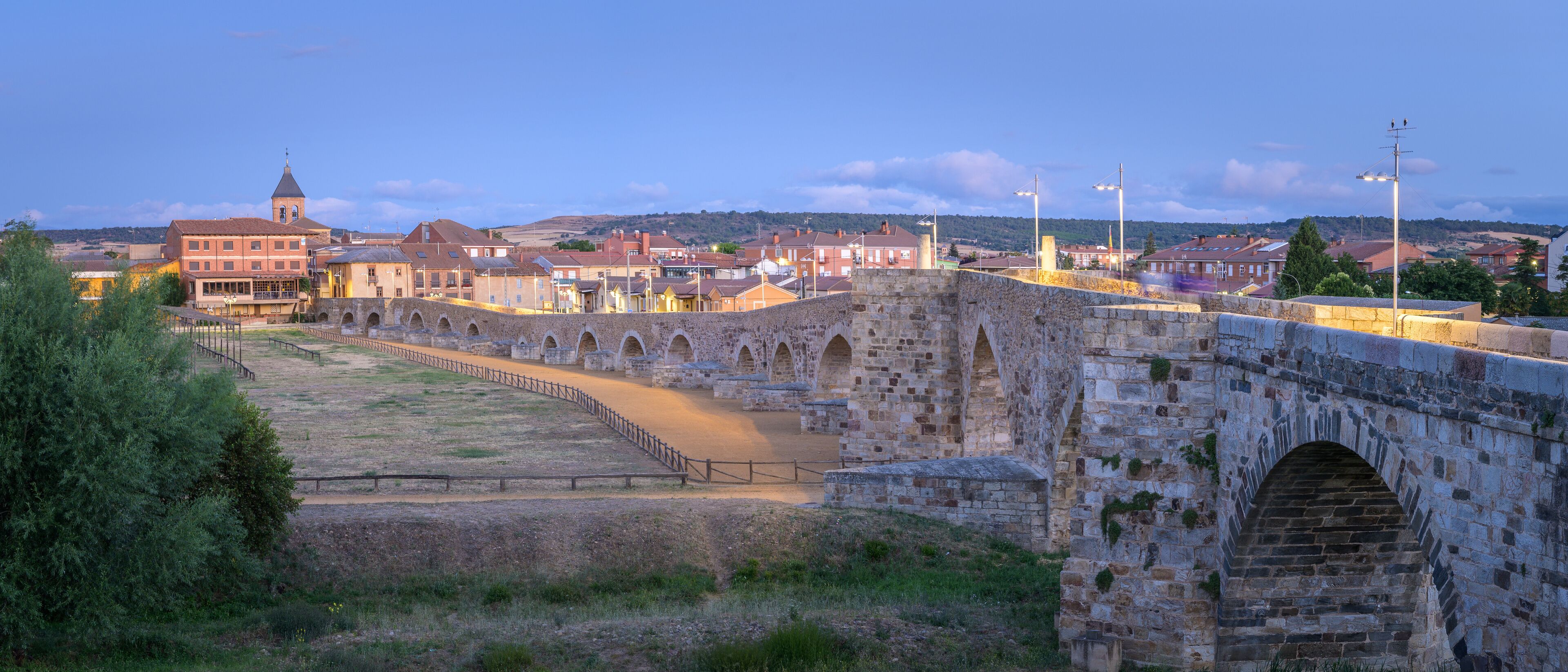 Summer's Awakening: Unveiling the Roman Bridge along the Camino de Santiago in Hospital de Orbigo, Leon, Spain