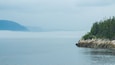 Sentier de la Pointe-de-l\'Islet featuring mist or fog and a river or creek